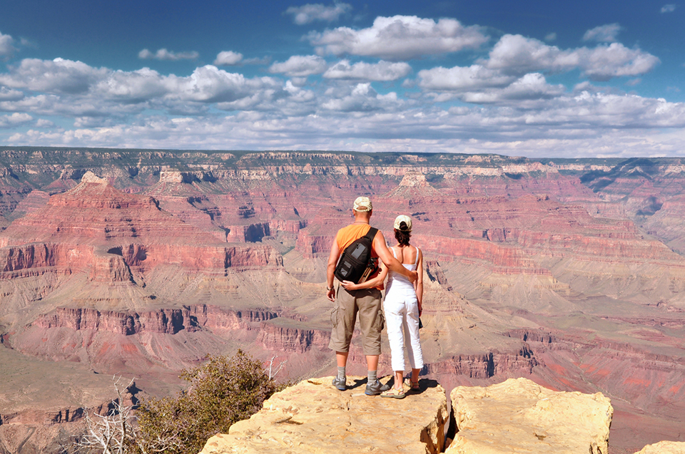 People look out on the Grand Canyon