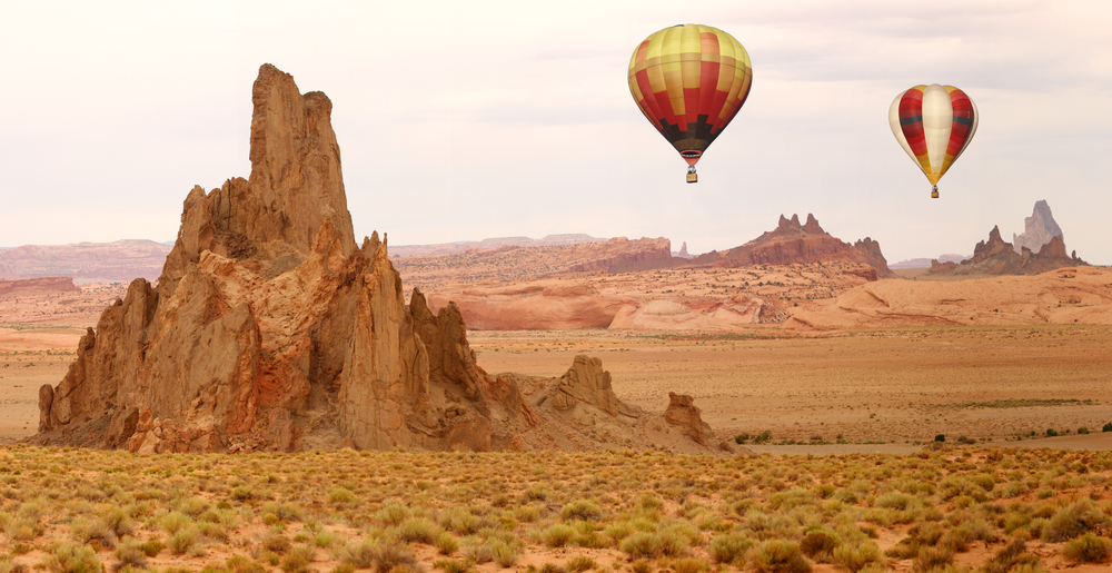Hot Air Balloon Flying Over New Mexico Desert Landscape