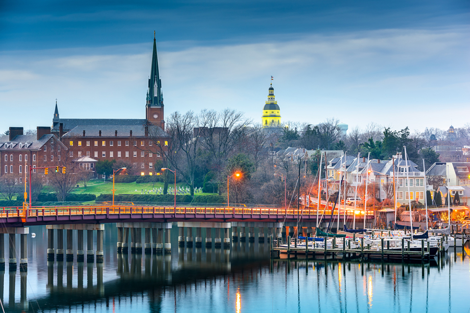 Annapolis, Maryland, USA State House and St. Mary's Church viewed over Annapolis Harbor and Eastport Bridge.